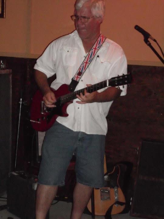 Greg Hall playing lead guitar live