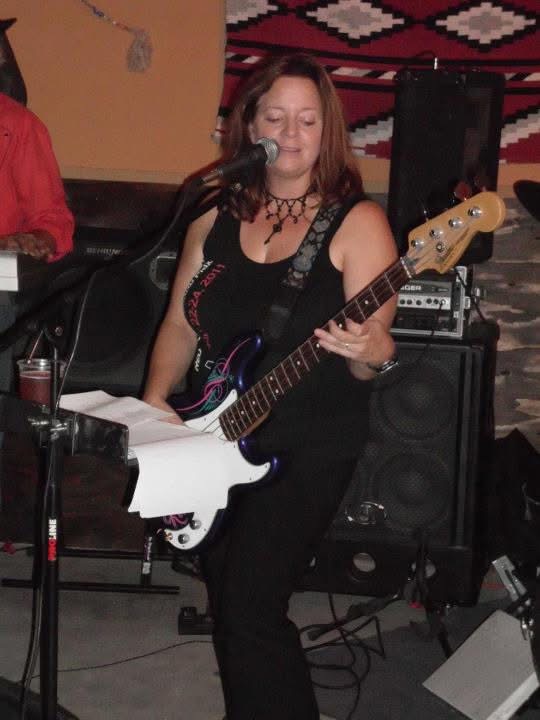 Kiri Mariposa Hall singing and playing bass live
