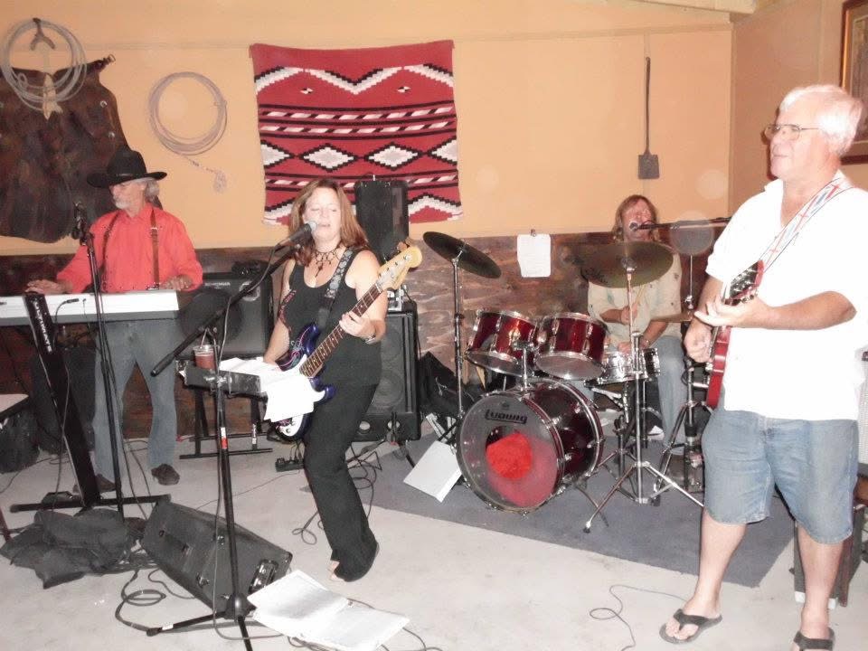 The band performing on a Southwest-themed stage