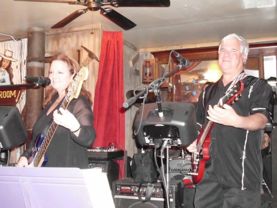 Kiri and Greg playing live on stage
